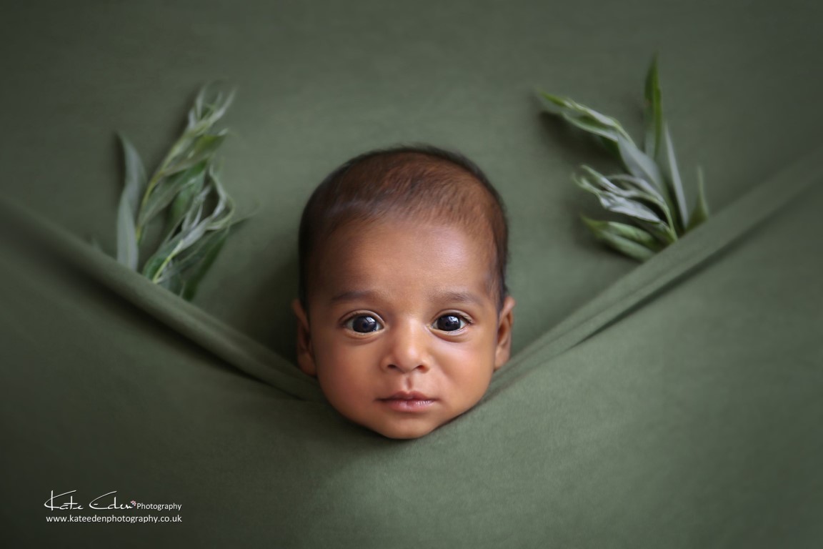 A newborn baby boy in green - Kate Eden Photography - Milton Keynes baby photographer