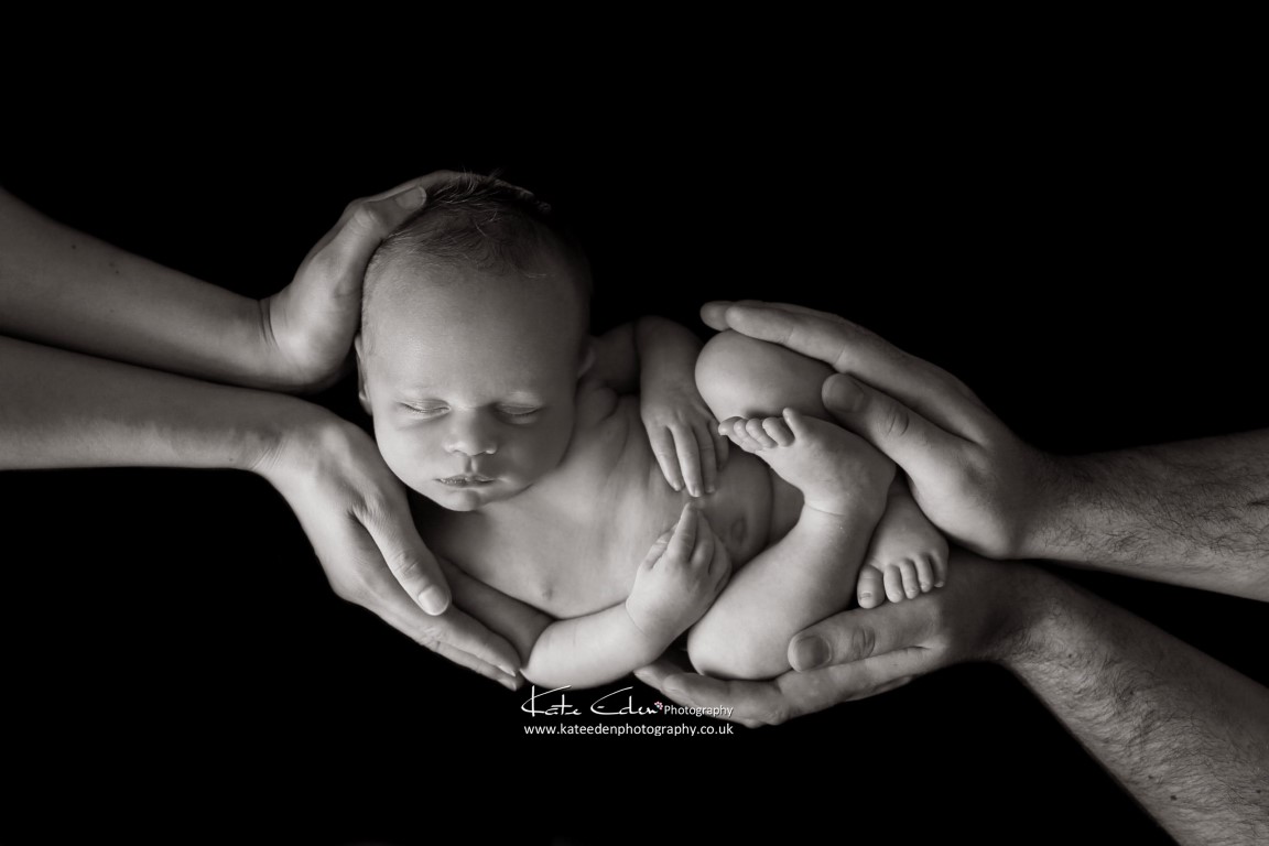 Safe in his parents' hands - Kate Eden Photography - Newborn photographer Milton Keynes - Buckinghamshire
